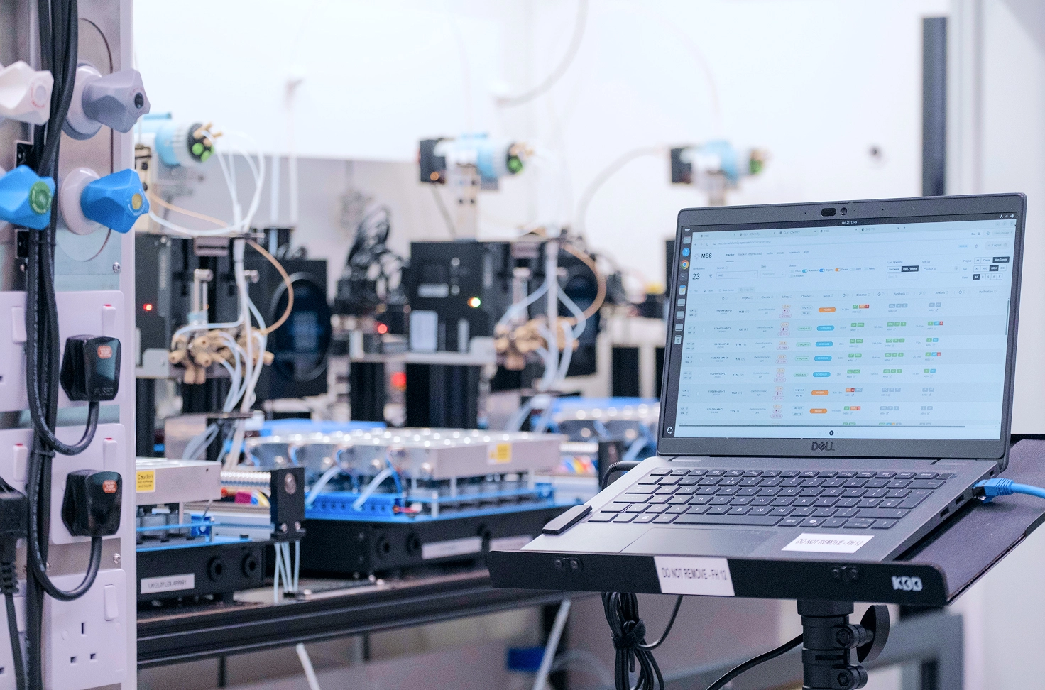 Laptop open running Chemify's software in a modern chemistry lab