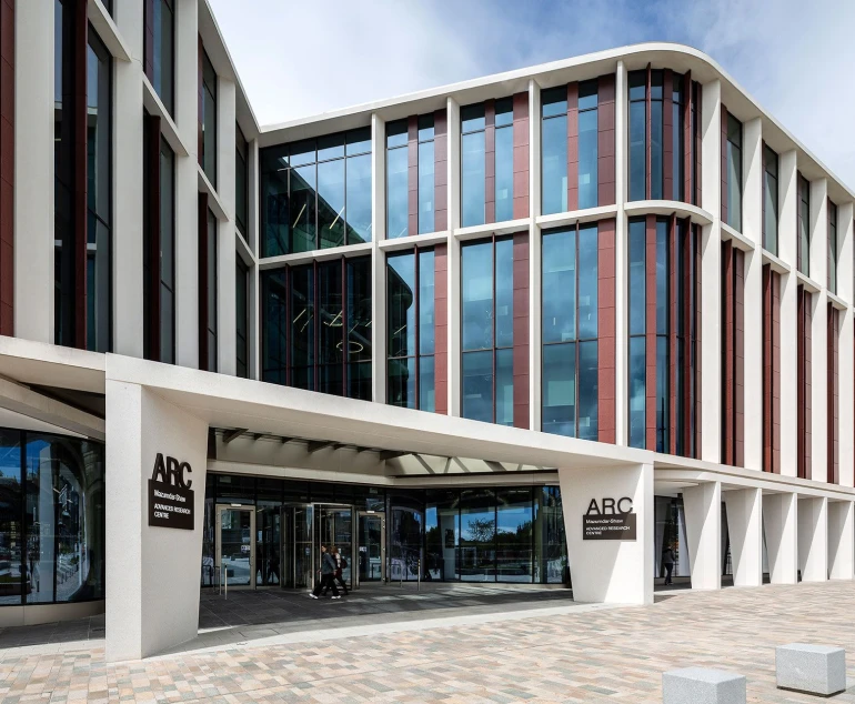 Chemify's headquarters in a modern 4-story building with large glass windows.