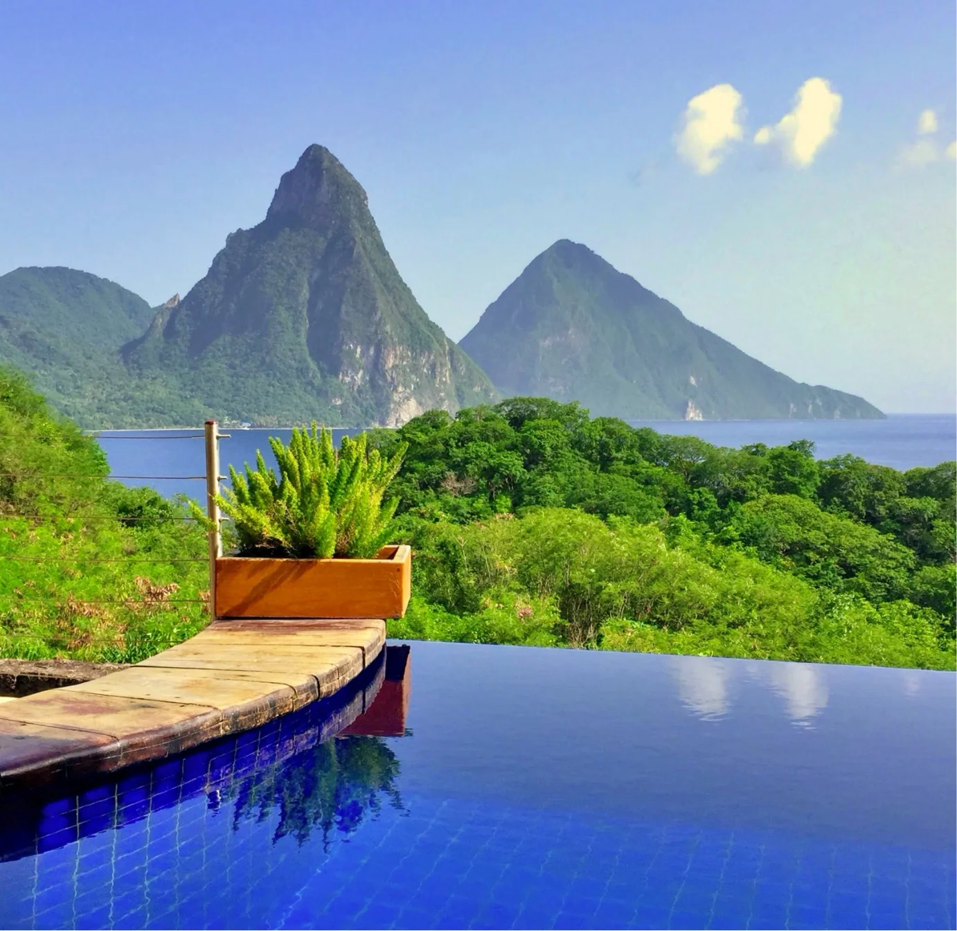 View of the Pitons and luxury villas overlooking the sea in Saint Lucia