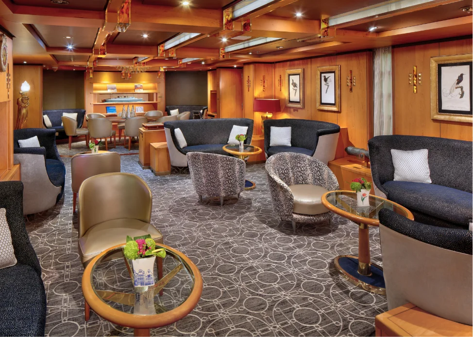 Neptune Lounge aboard Zuiderdam with white table settings
