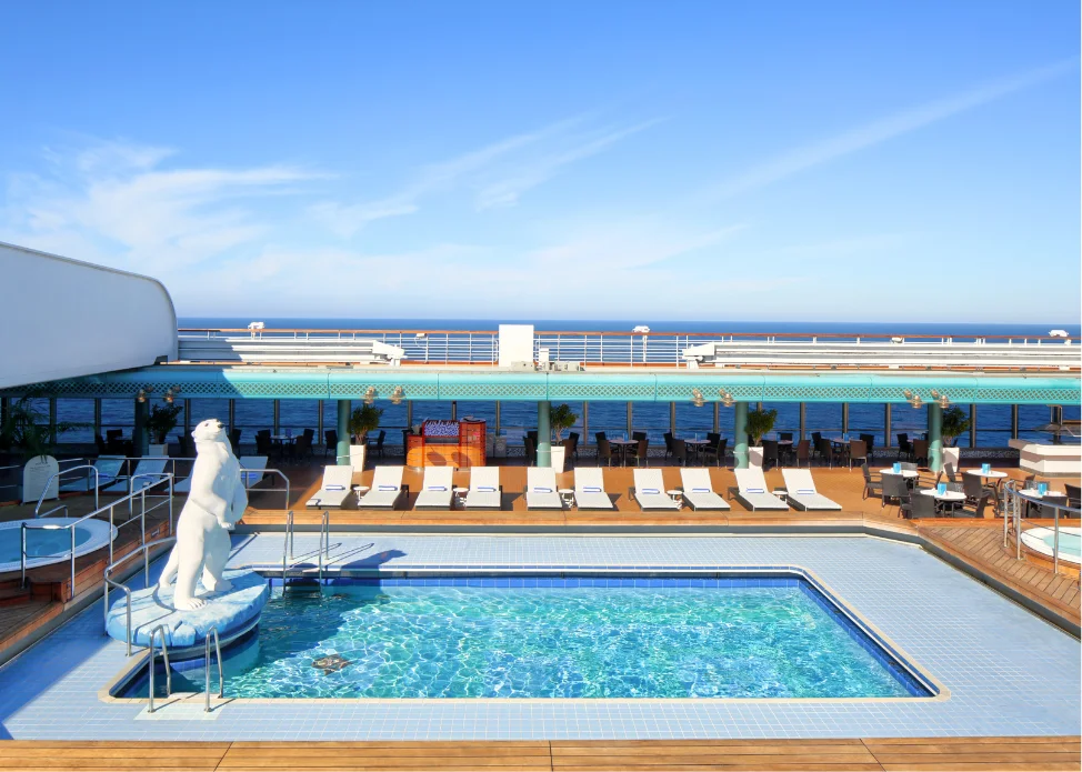 Deck view overlooking pool and loungers aboard Zuiderdam