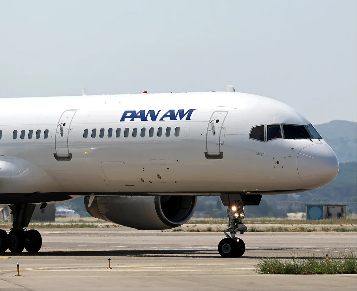 A Pan Am Boeing 757 prepares for takeoff, symbolizing the beginning of an extraordinary journey.