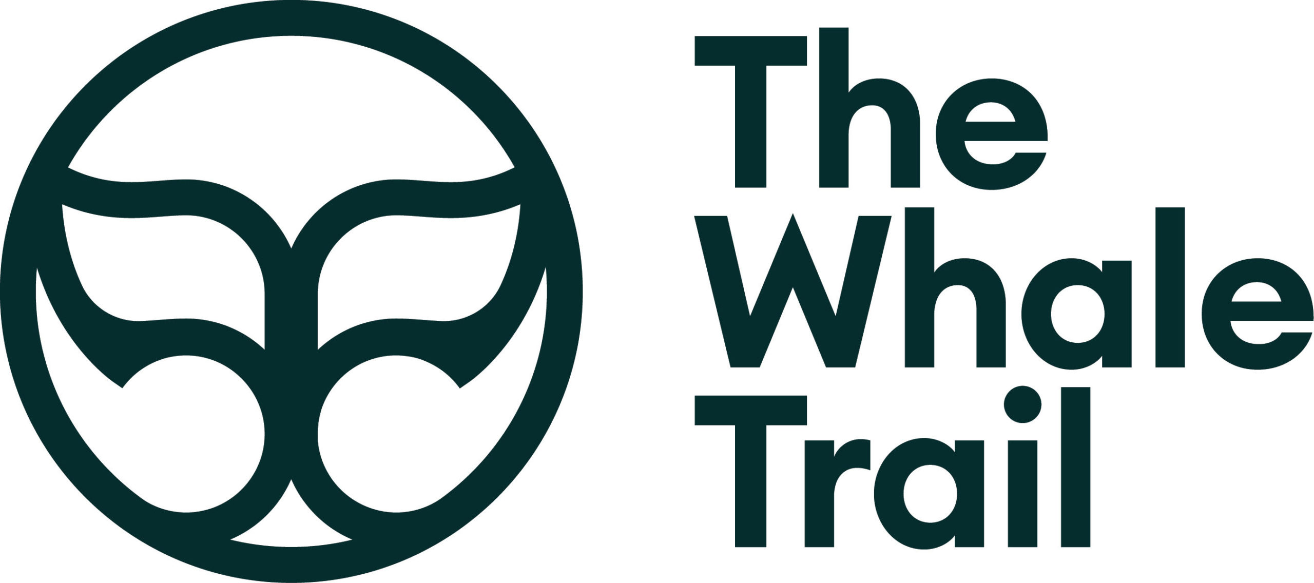 The Whale Trail logo with stylised whale tail inside a circle beside the text.