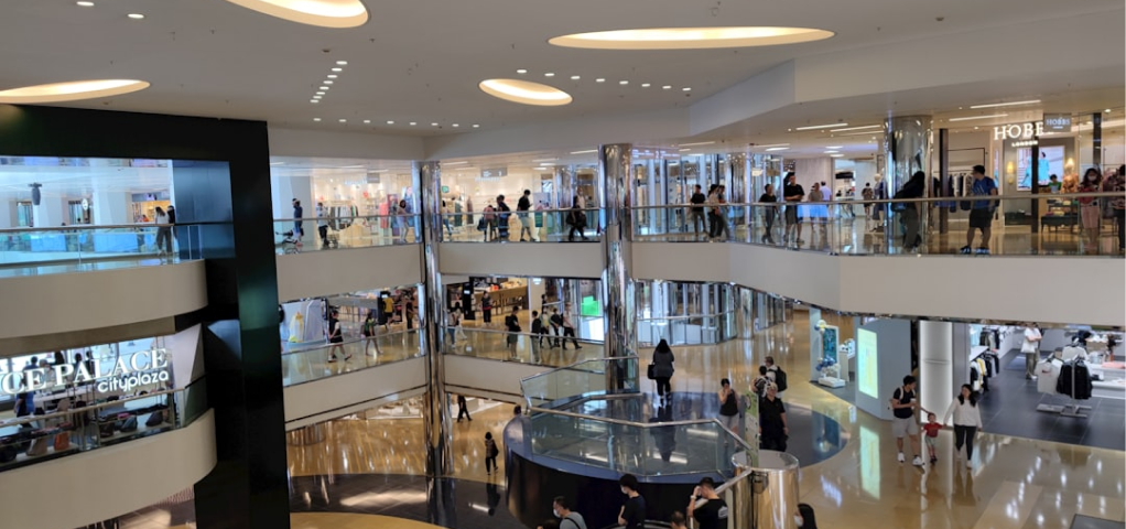 Grayscale photograph of a multi-level interior space.