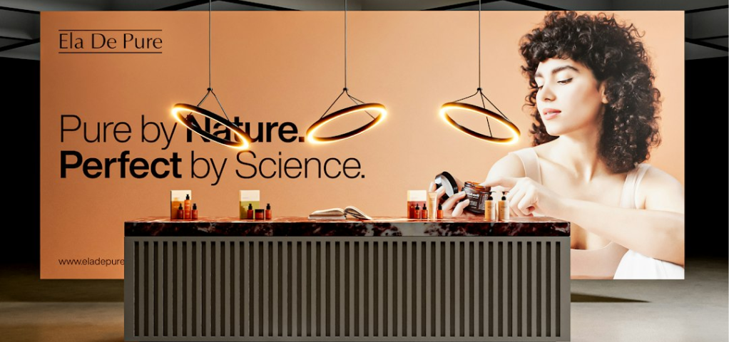 Grayscale photograph of a product display with text and a person.