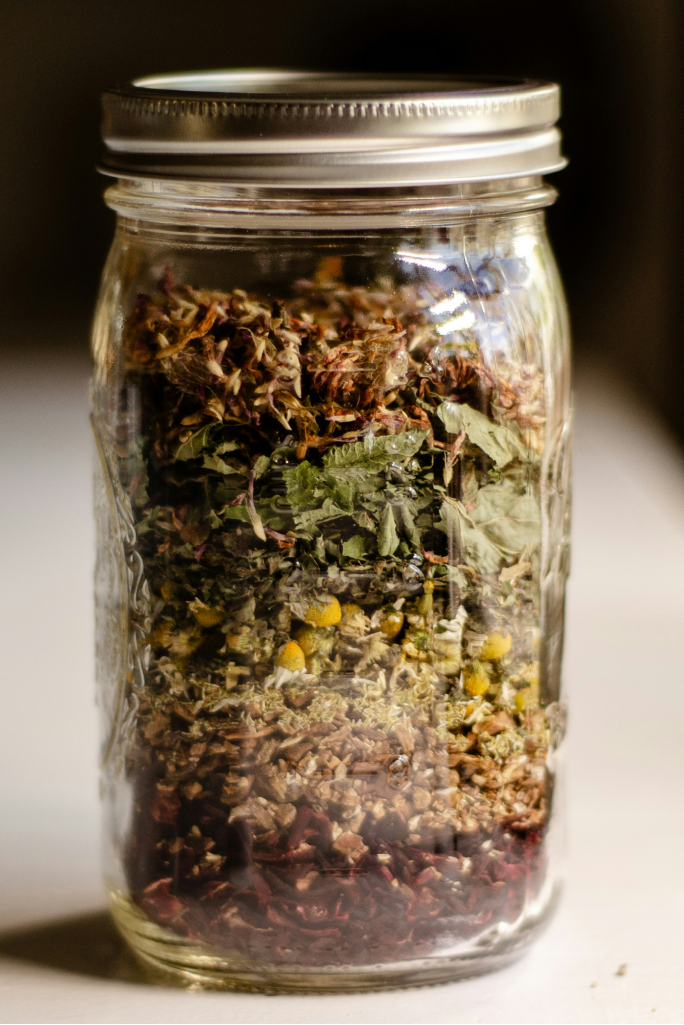Black and white photograph of a glass jar filled with material.
