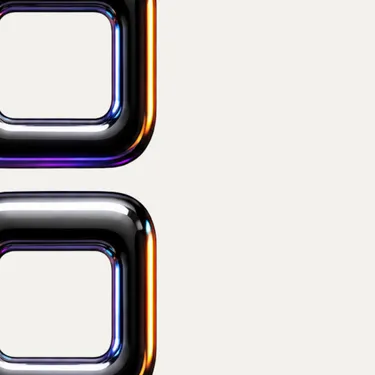 Close-up of two overlapping rounded metallic squares with gradient reflections on a light background.