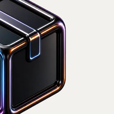 Close-up of a metallic black cube with glowing blue and orange edges on a light background.