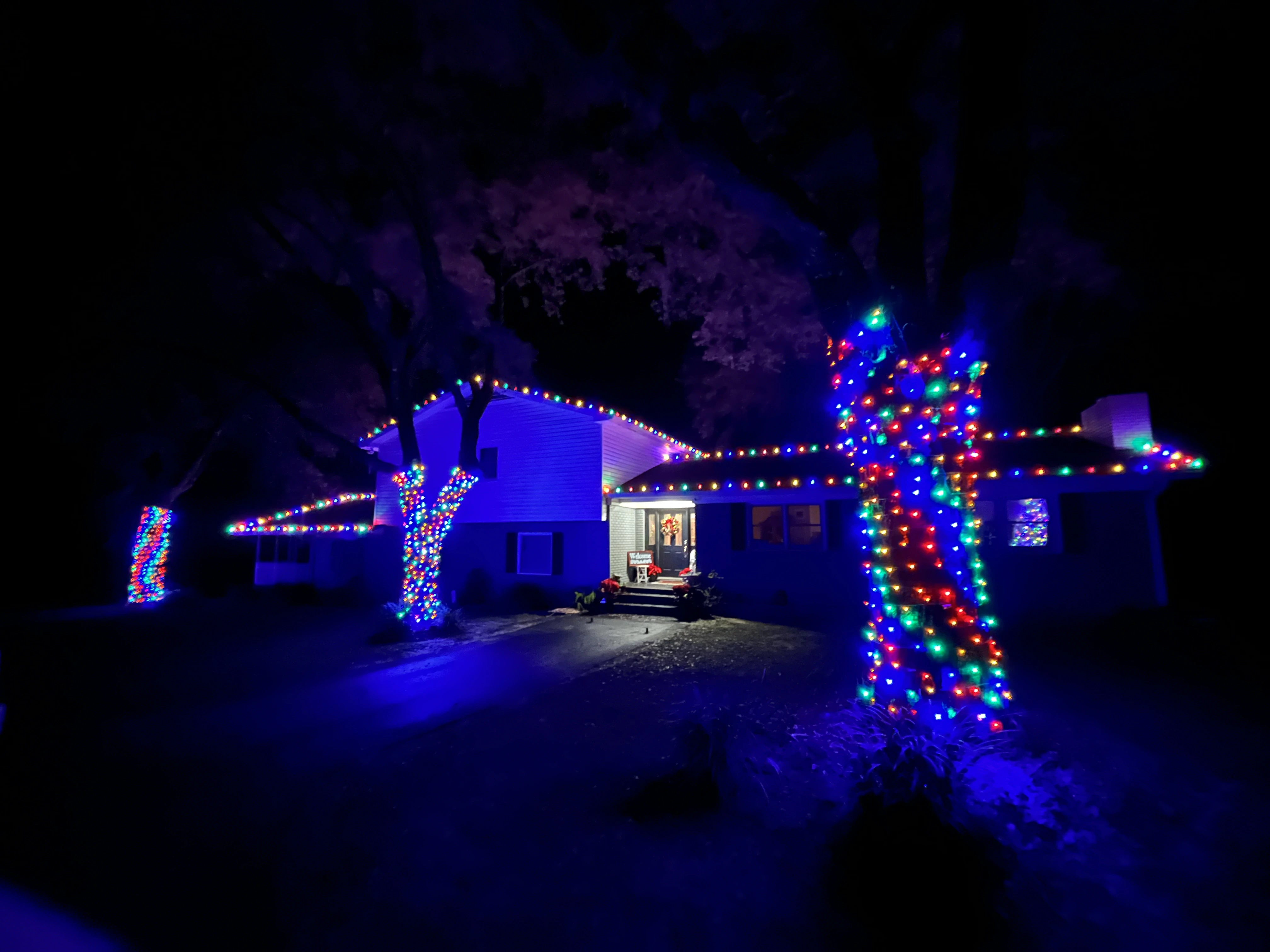 A house decorated with different lights.