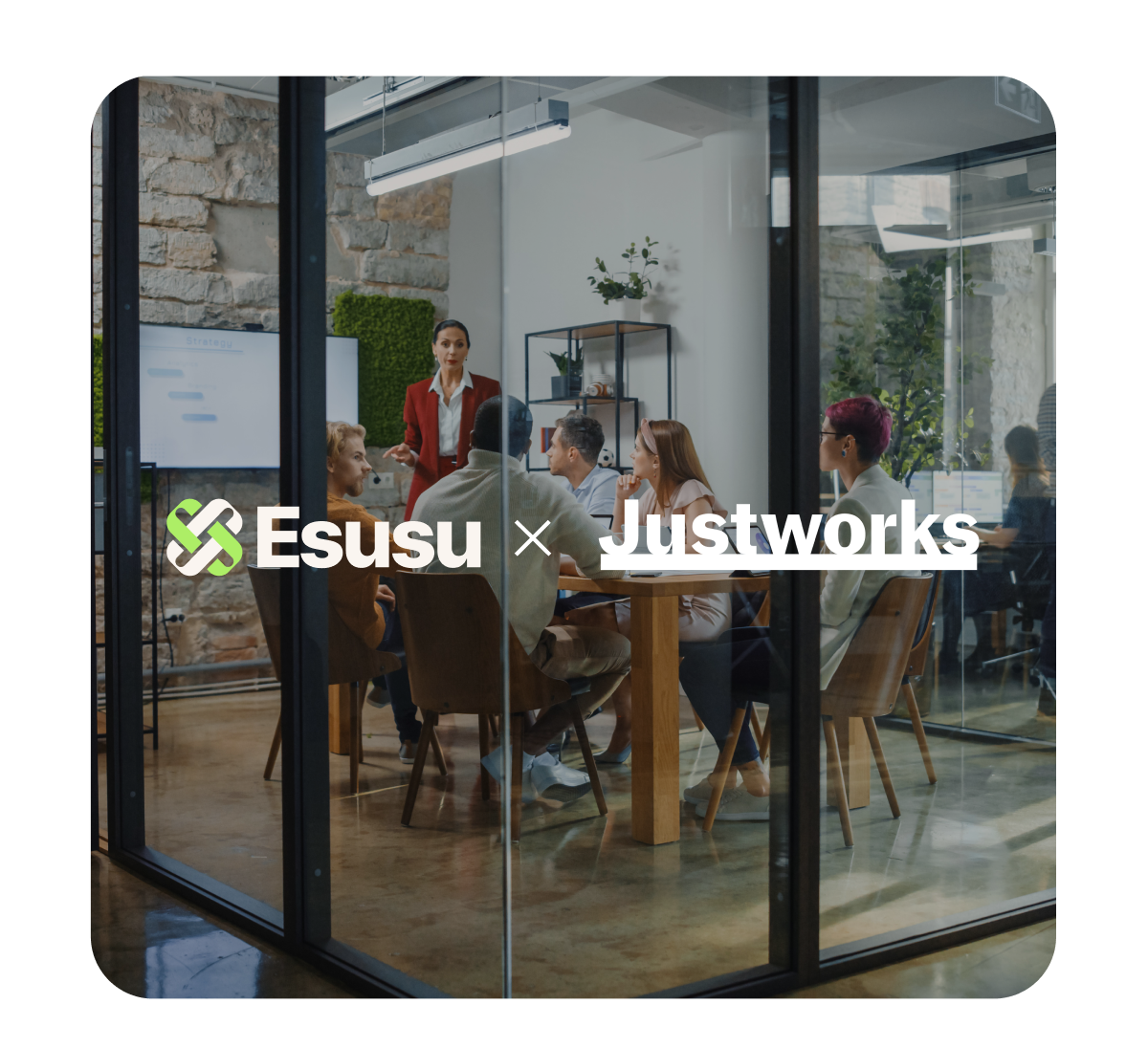 Team meeting in a modern glass-walled conference room with a woman standing and presenting to five seated colleagues.