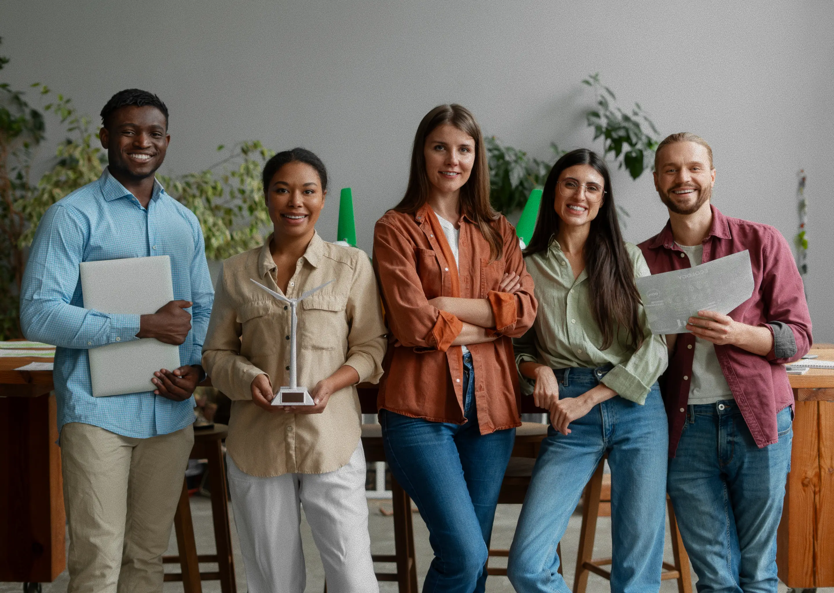 Students talking and smiling together during a break in their group project.