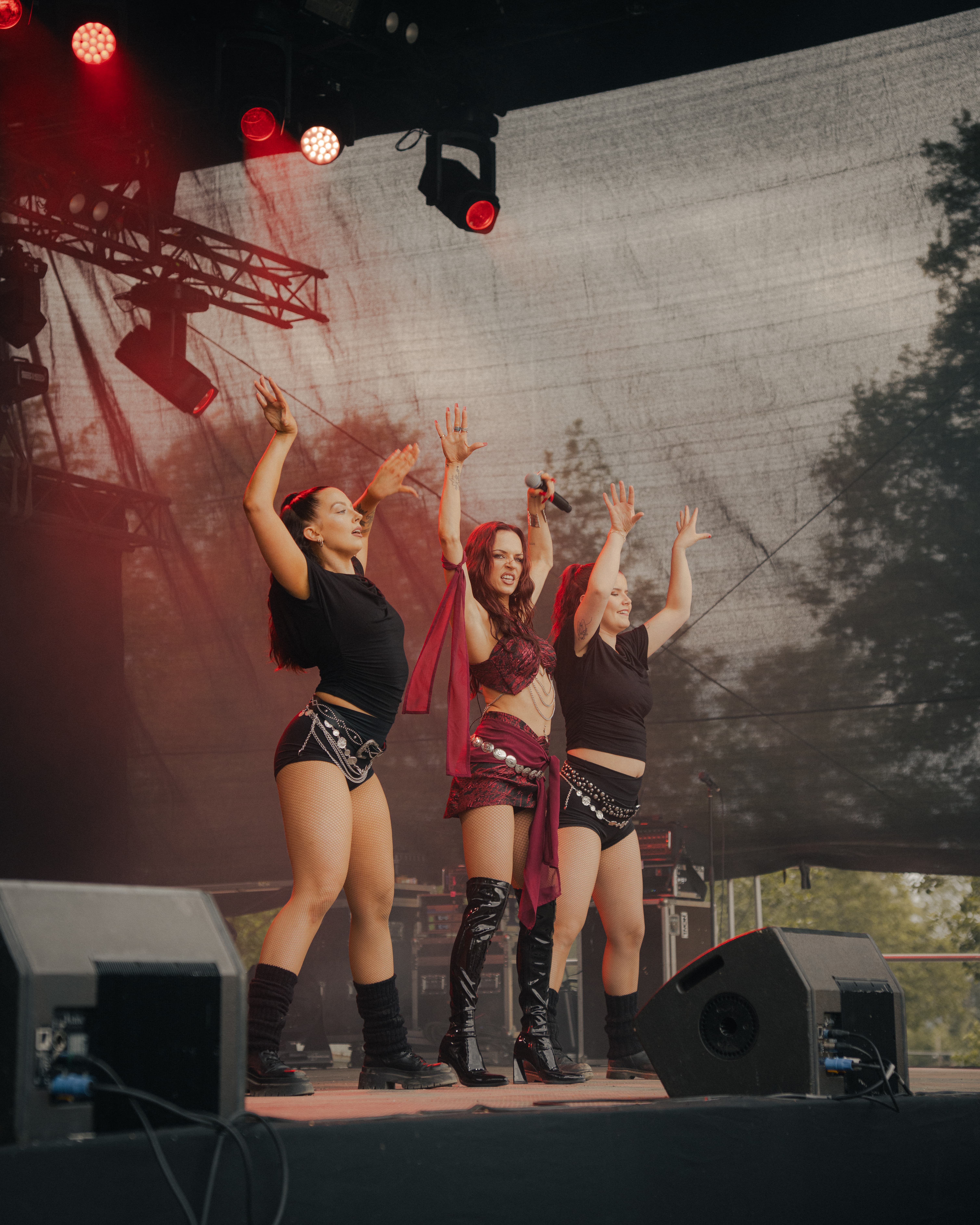 Picture of singer and two dancers performing