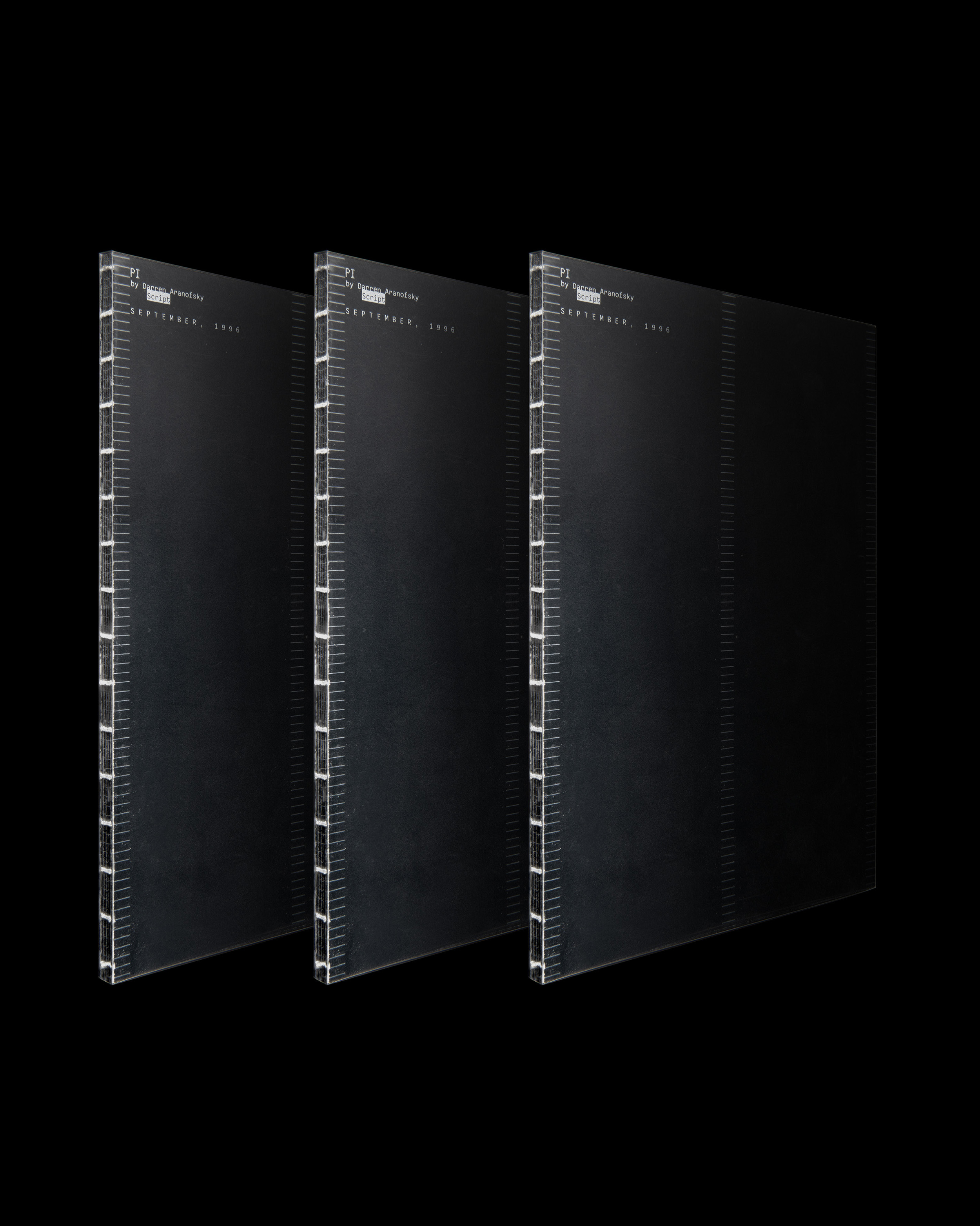 Three PI books that stand upwards side by side on black background