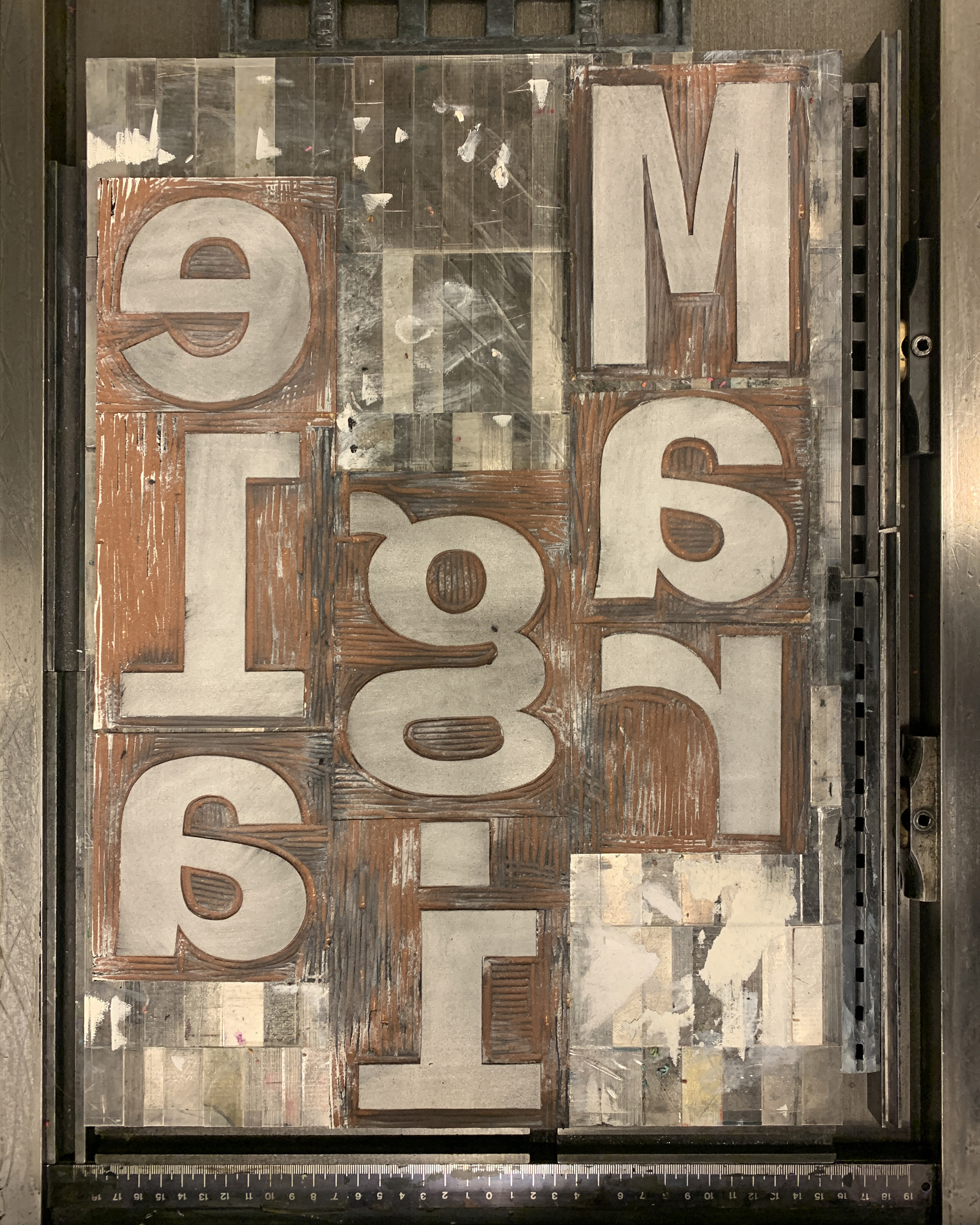 Handcutten Linol Letters spelling the Word "Margiela"