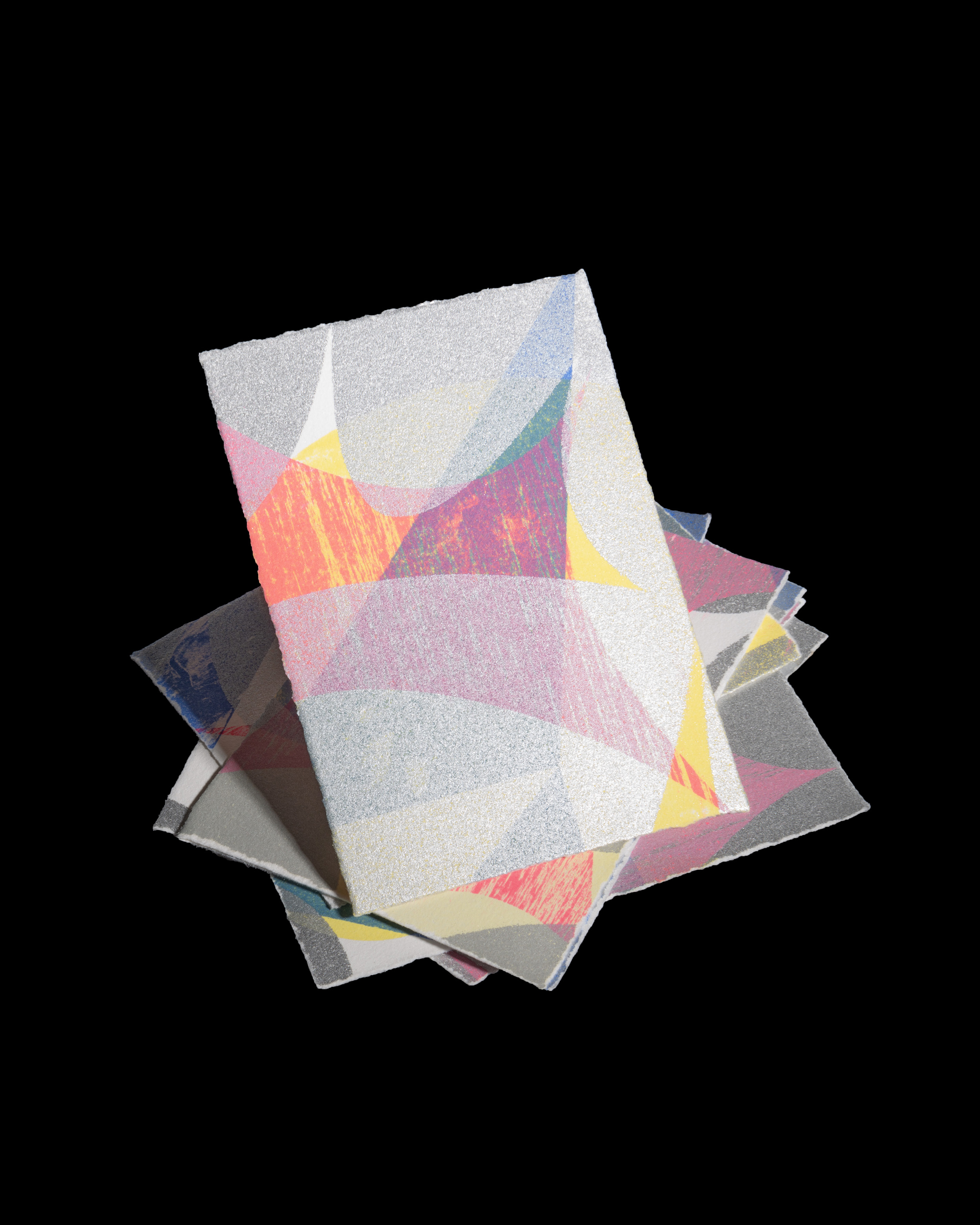 Staple of lithography cards on black background