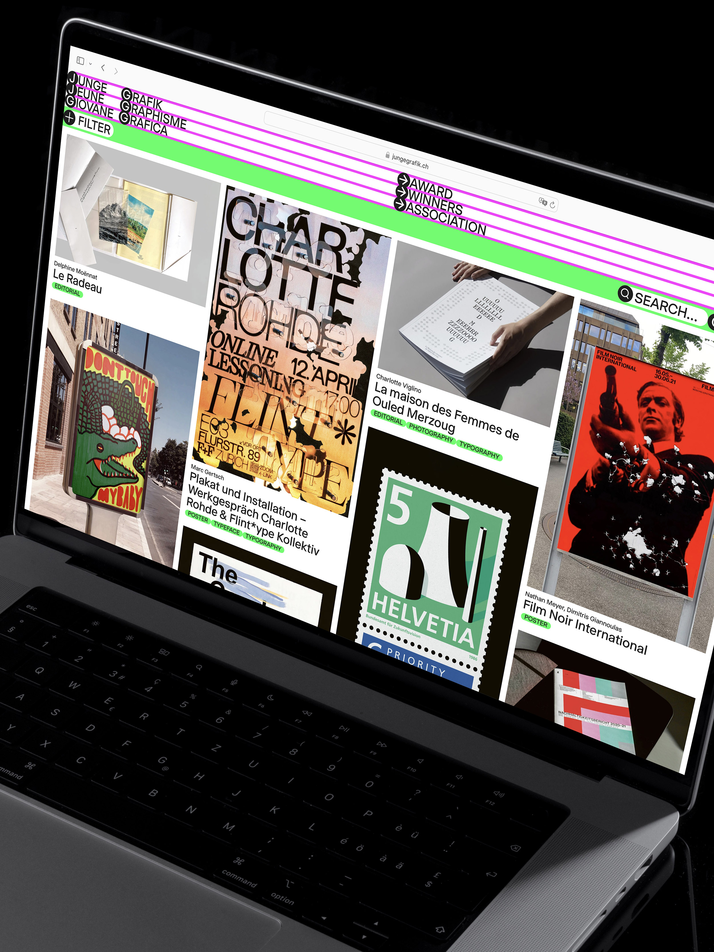 Laptop screen displaying the Junge Grafik website with thumbnails of posters, typography projects, and editorial layouts.