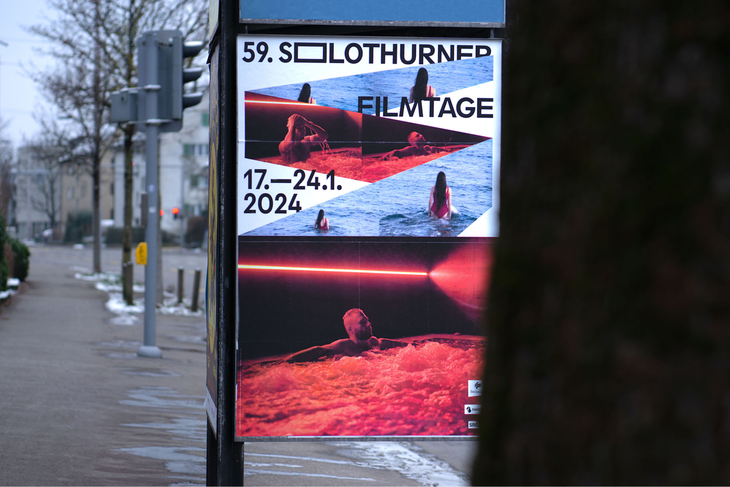 Outdoor advertisement poster showing a film event with images of people swimming and relaxing in water, dated January 17-24, 2024.