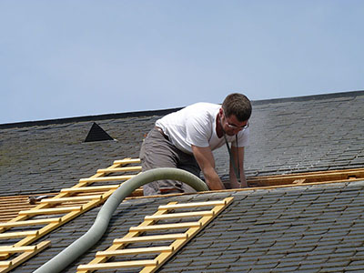 image of roofing contractor at work