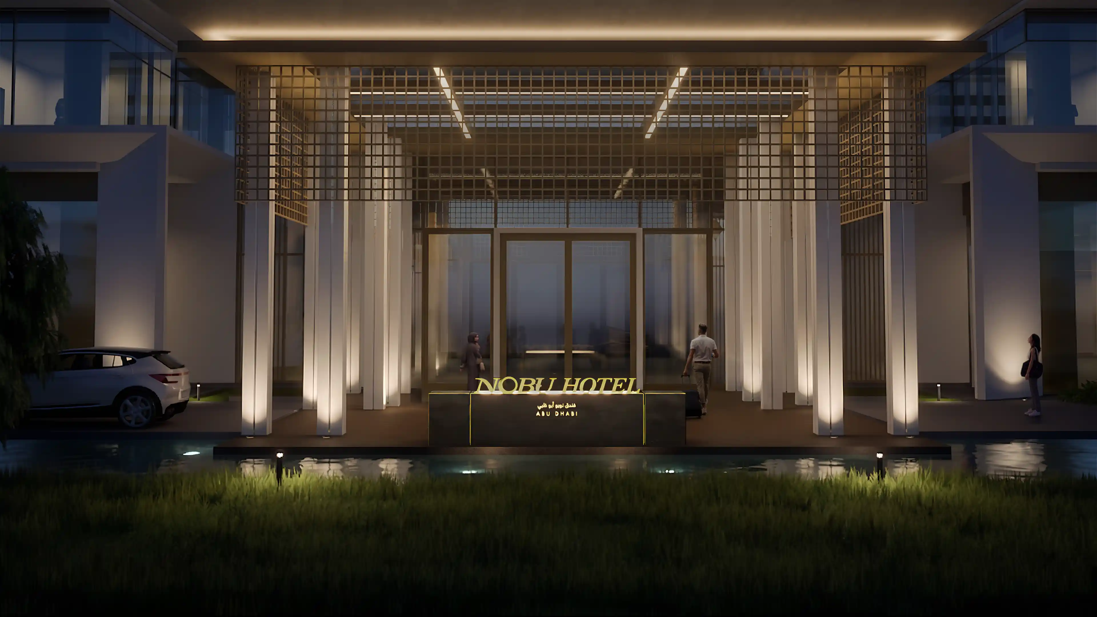 Nighttime view of the entrance to Nobu Hotel with pedestrians and vehicles guided by LIMAH's integrated wayfinding and directional signage