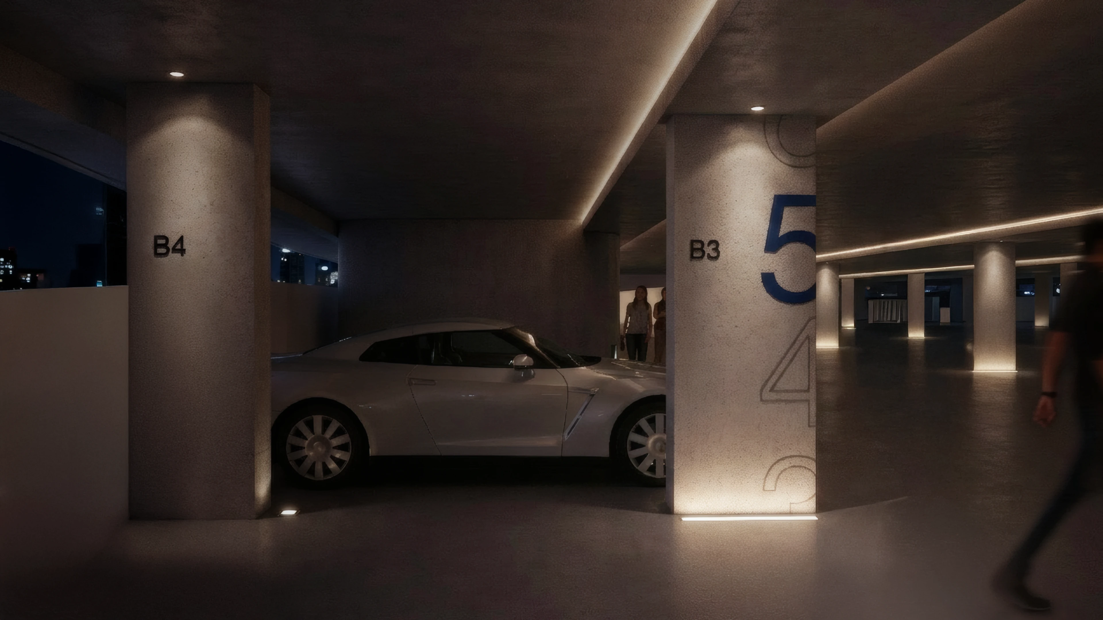 Column graphics at the Dubai Harbour Parking at nighttime, designed by LIMAH