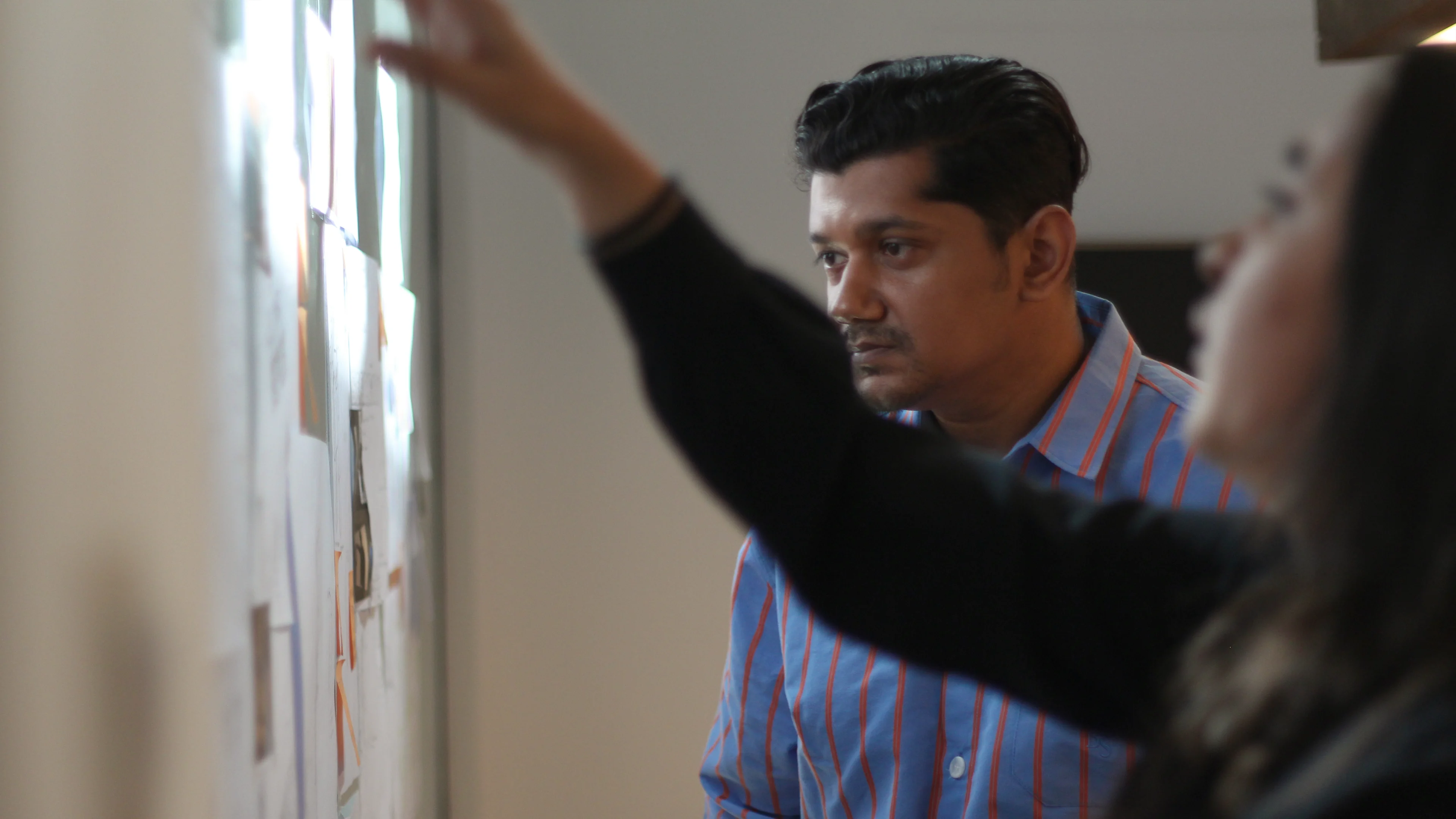 LIMAH designer presenting an experiential design concept during a collaborative strategy session