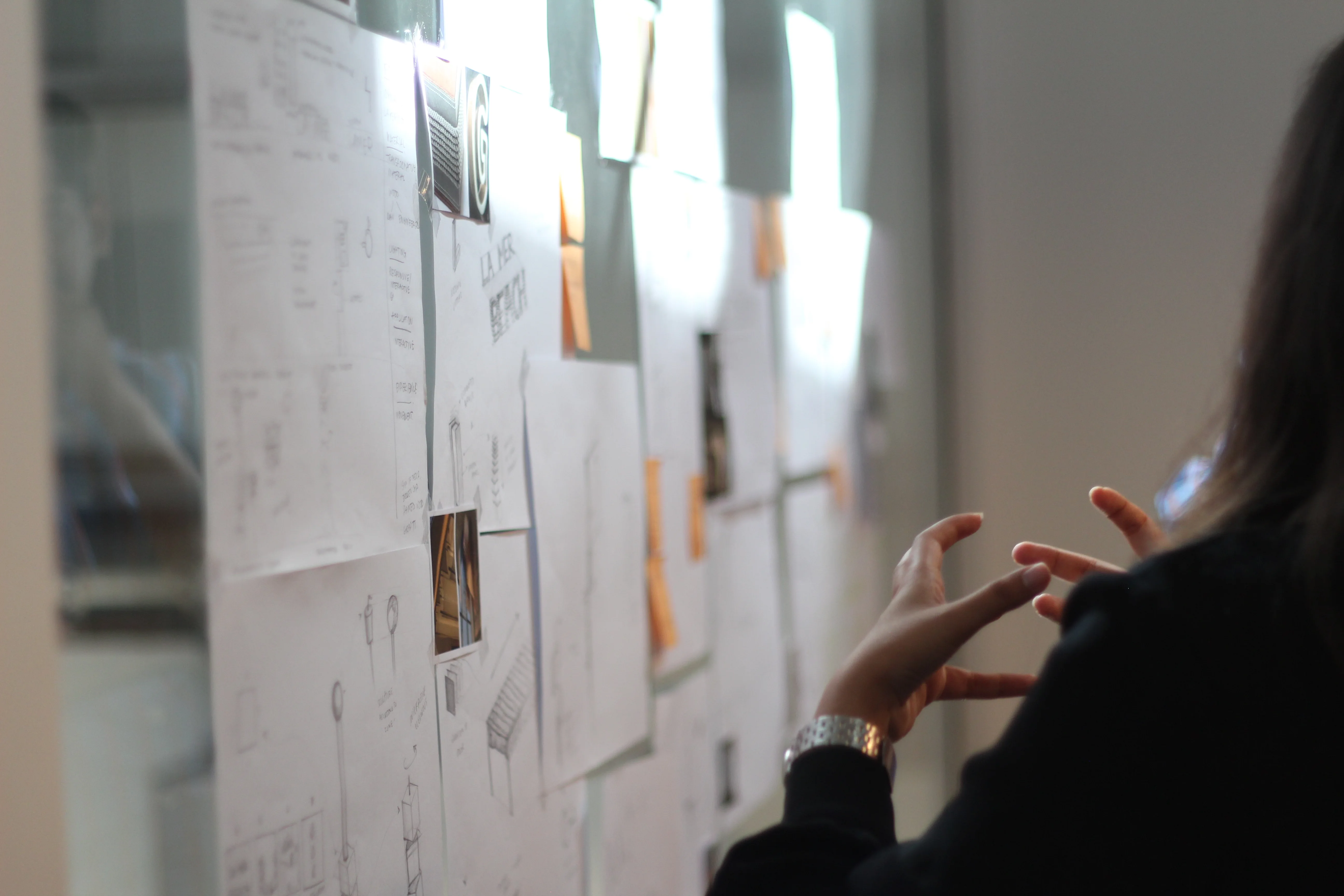 LIMAH designer reviewing an experience strategy board during the design process