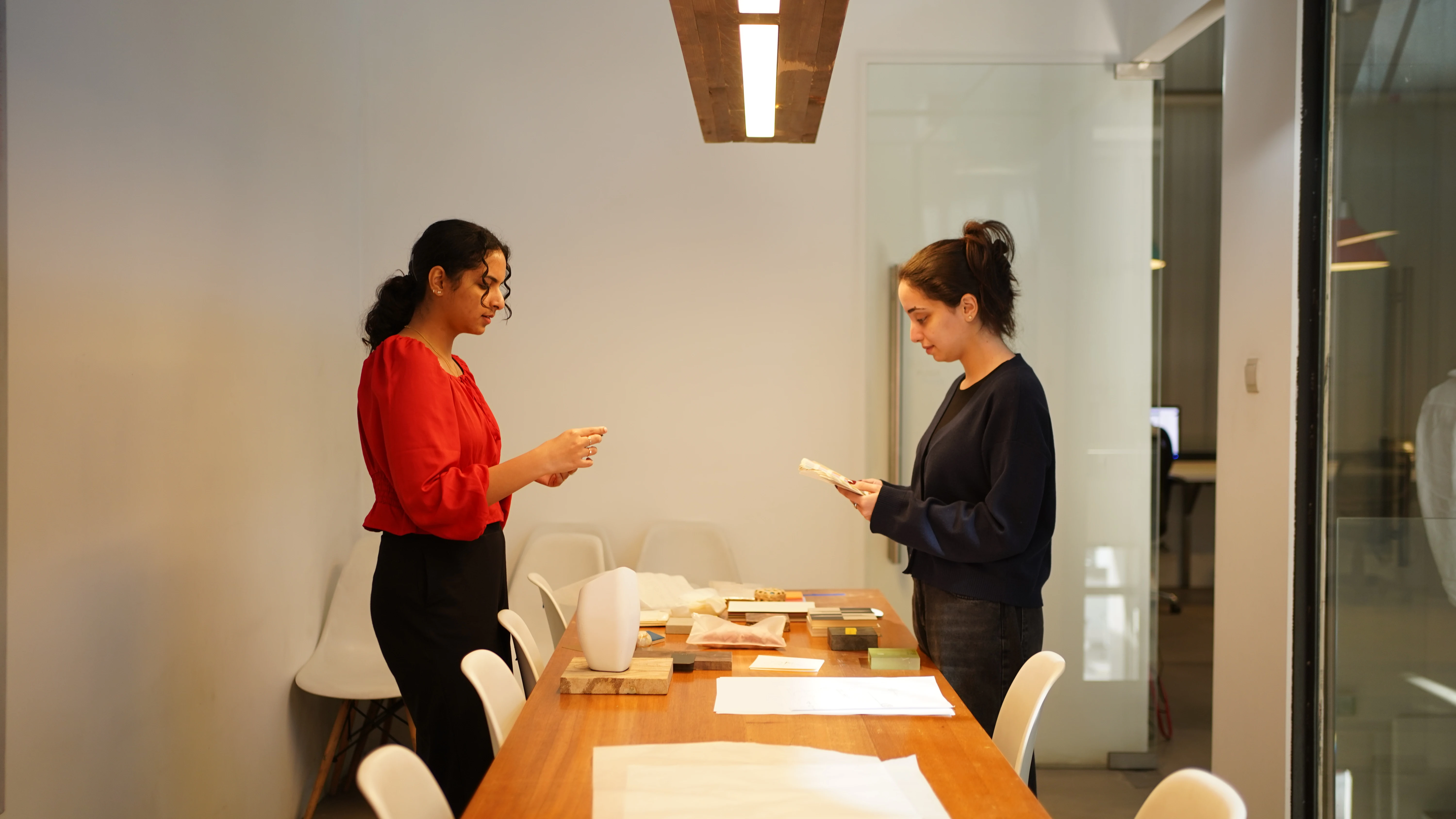 Two LIMAH designers reviewing early concepts for user experience and experience strategy