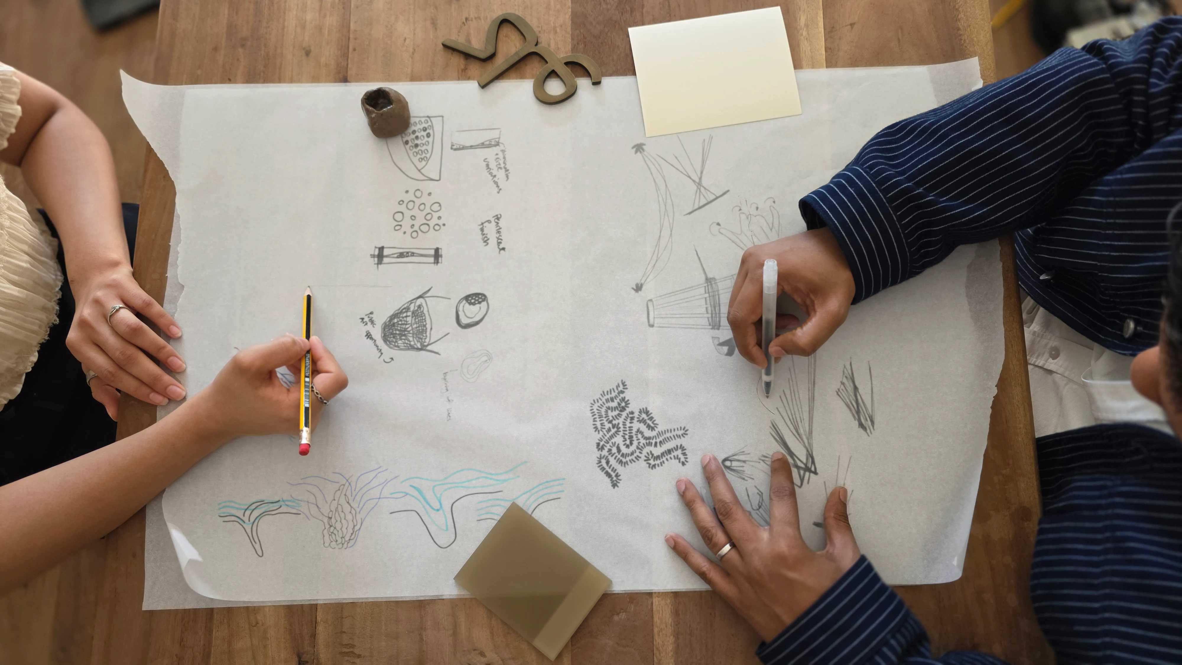 LIMAH designers developing initial sketches for a public art strategy during a creative workshop
