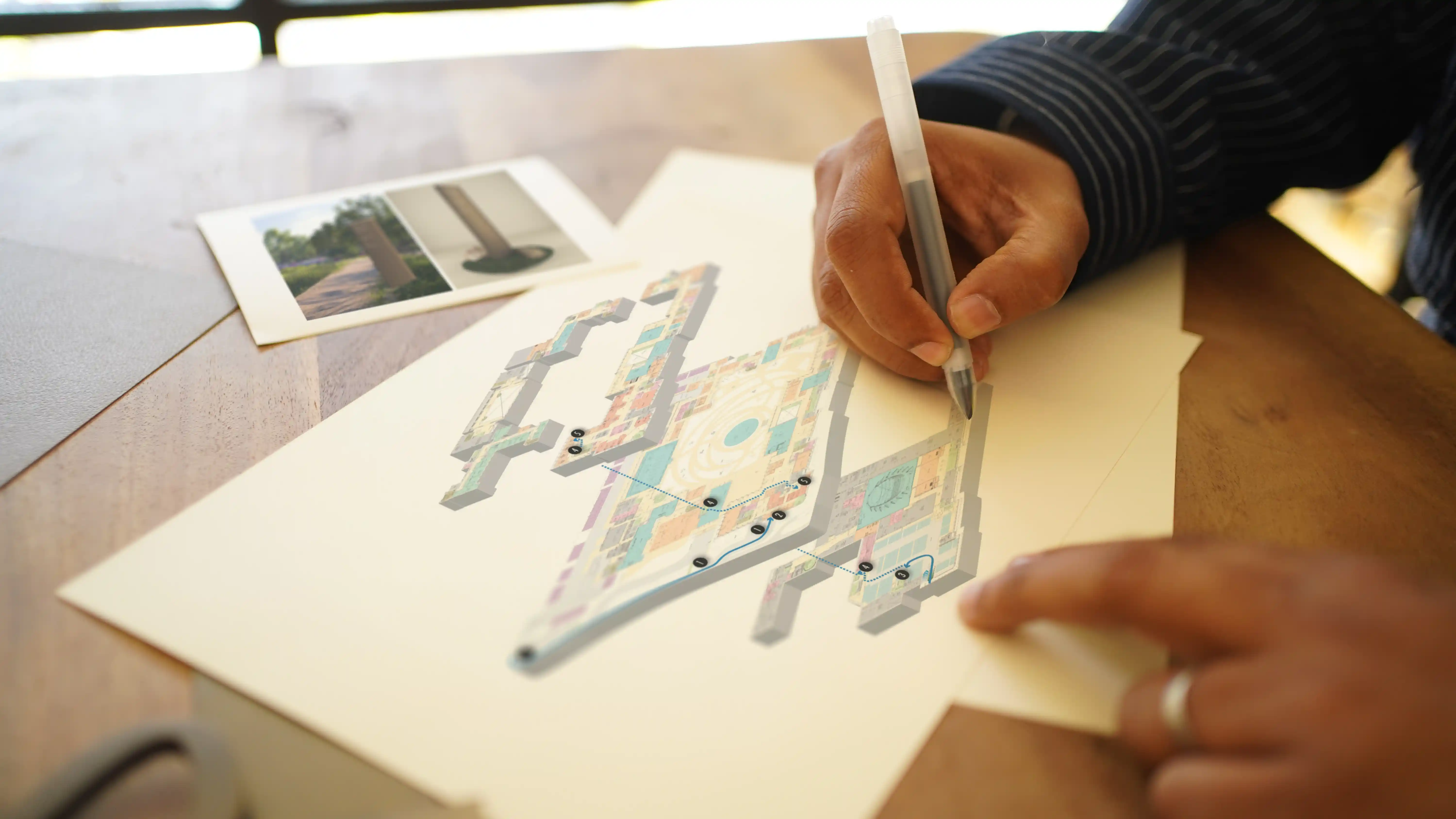 LIMAH designer mapping a user journey through a multi-level building