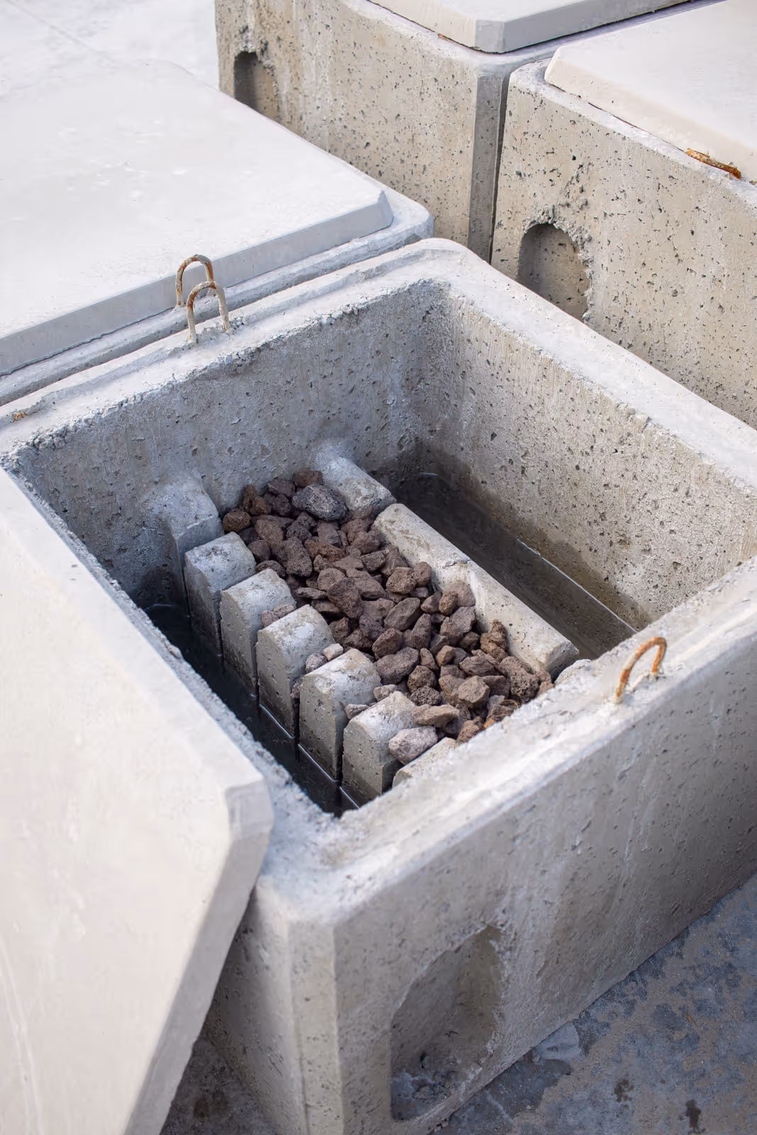 Filterput met lavasteen als voorfilter tussen regenput en infiltratieput