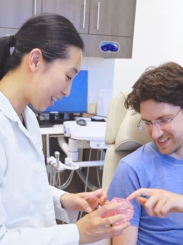Carson city dentist with a patient showing dental models