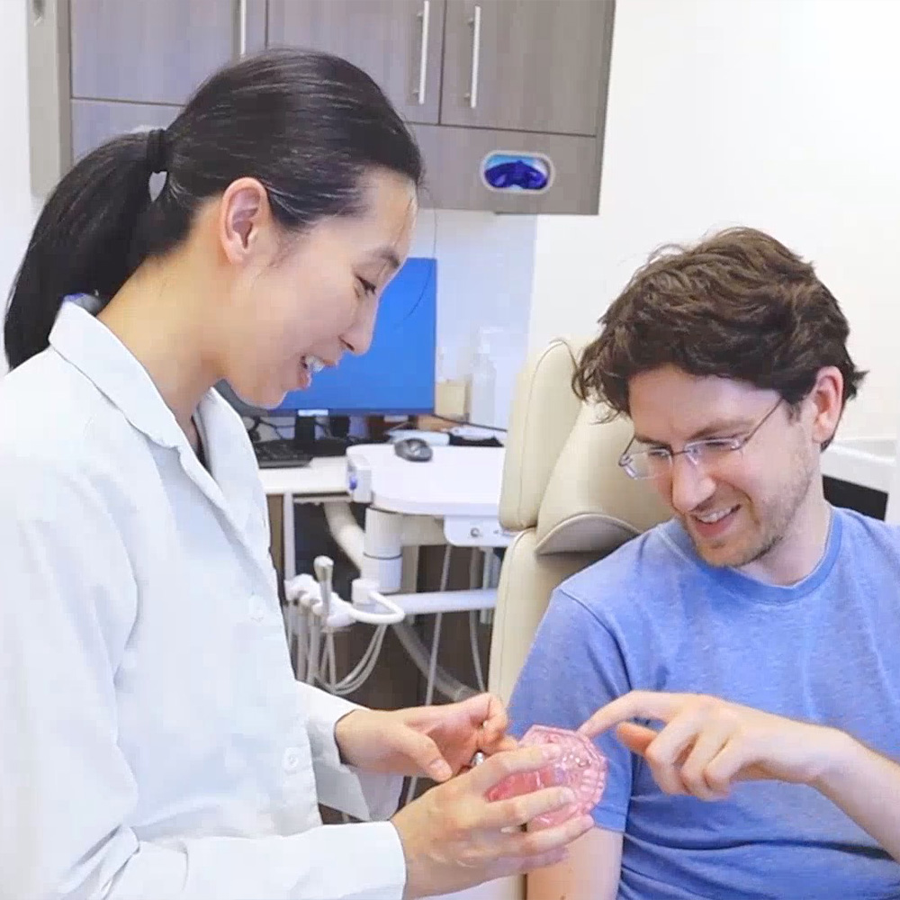Carson city dentist with a patient showing dental models