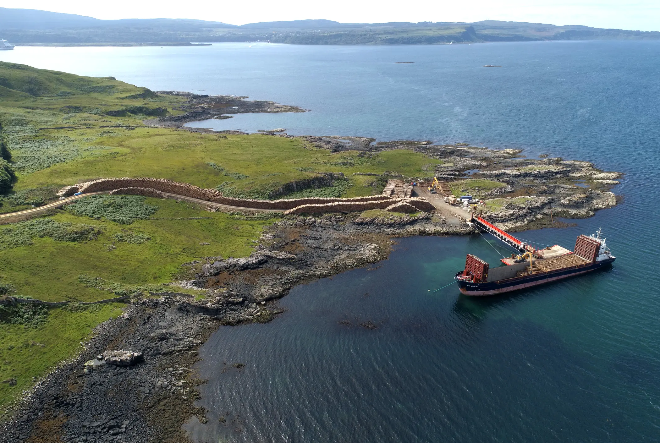 A large boat is docked in a body of water.