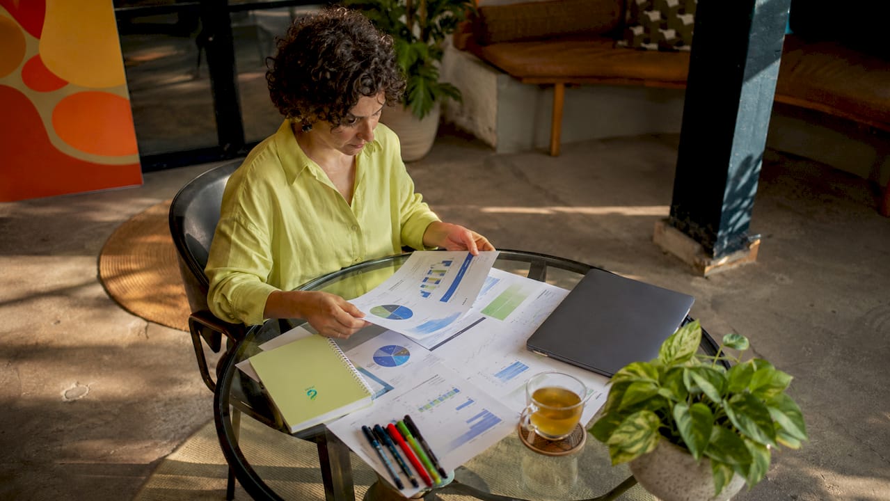 SEO analyst reviewing reports at desk