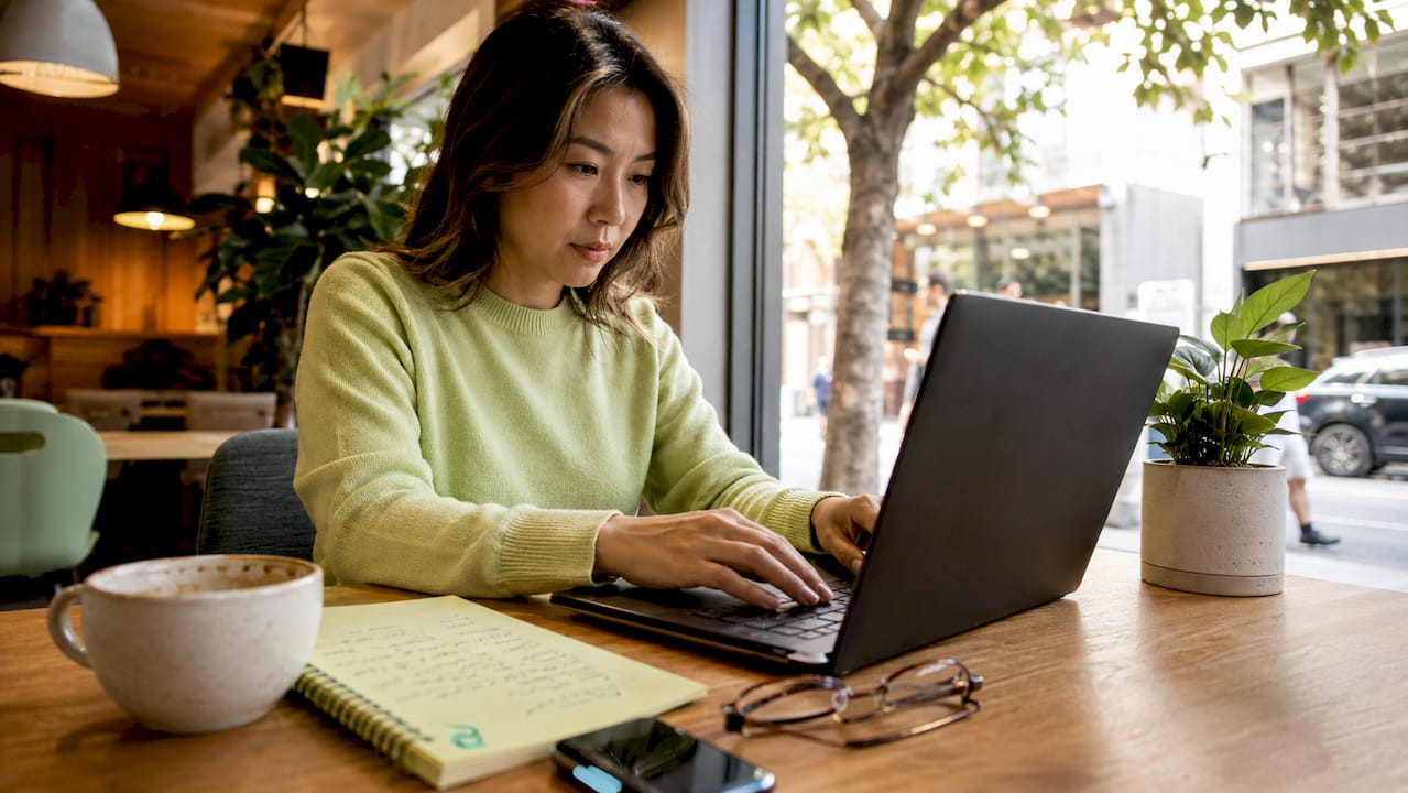 Woman coding page speed analysis in home office