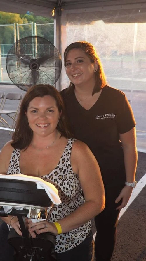 a woman about to receive a massage under a tent