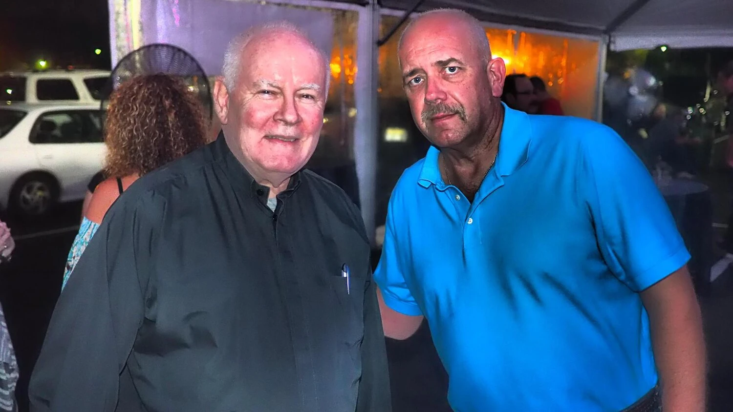 two men taking a photo together