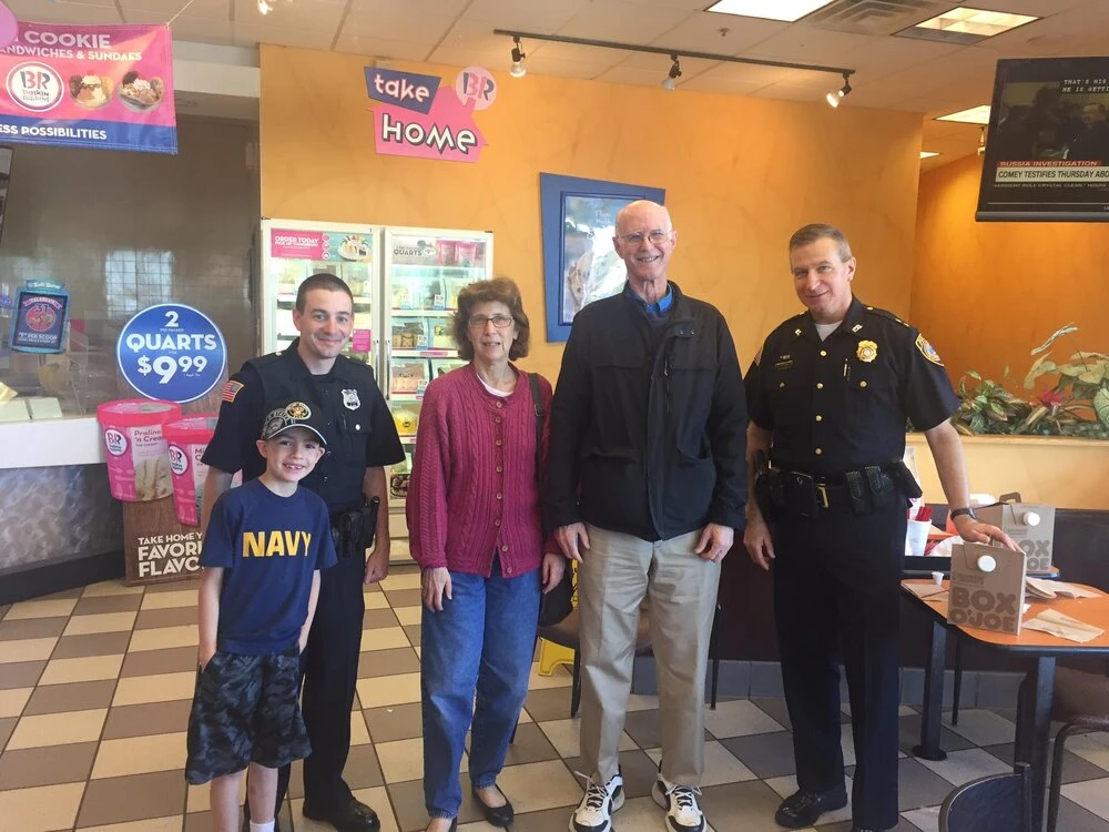 family and officer in a coffee shop