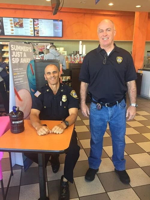 two people at a coffee shop table