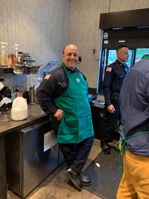 two officers working in the drive through window area