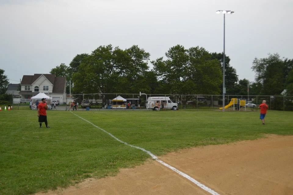 far away view of two player in the outfield 