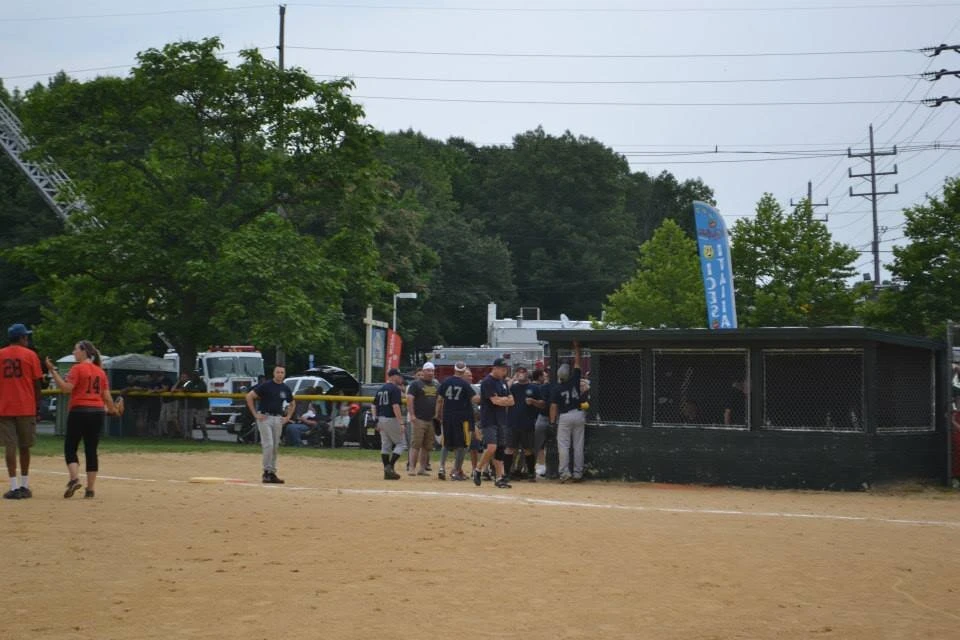 a team huddles together during a baseball game