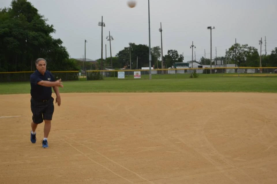 a person throwing a baseball through the air
