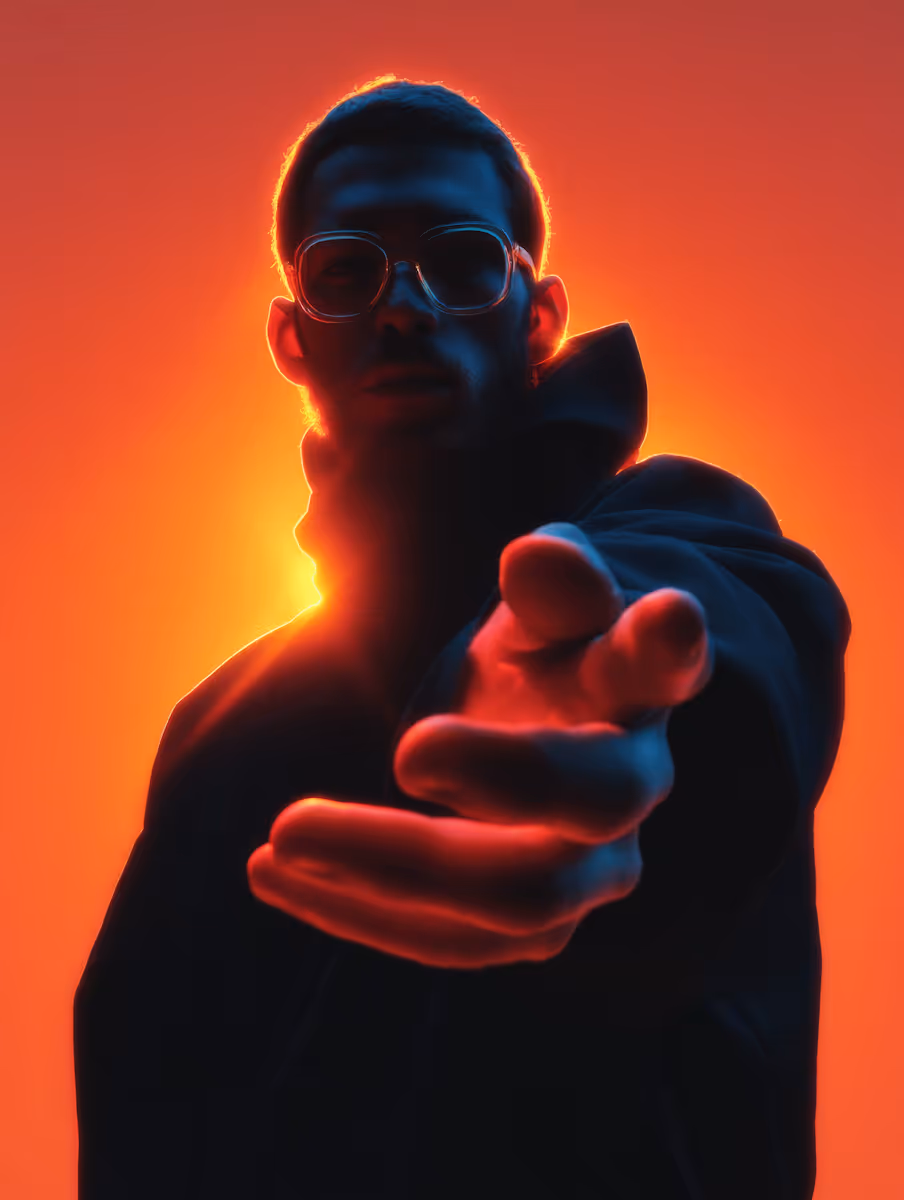 Silhouetted man with glasses reaching towards the camera against a vibrant orange backlight.