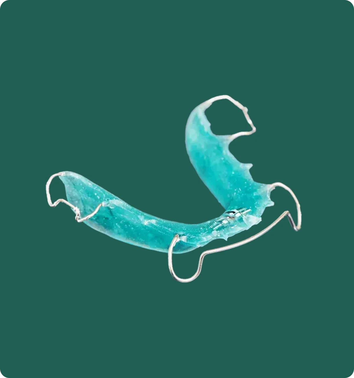 Clear orthodontic retainer fitted on a dental model, showing the precision trim around each tooth.