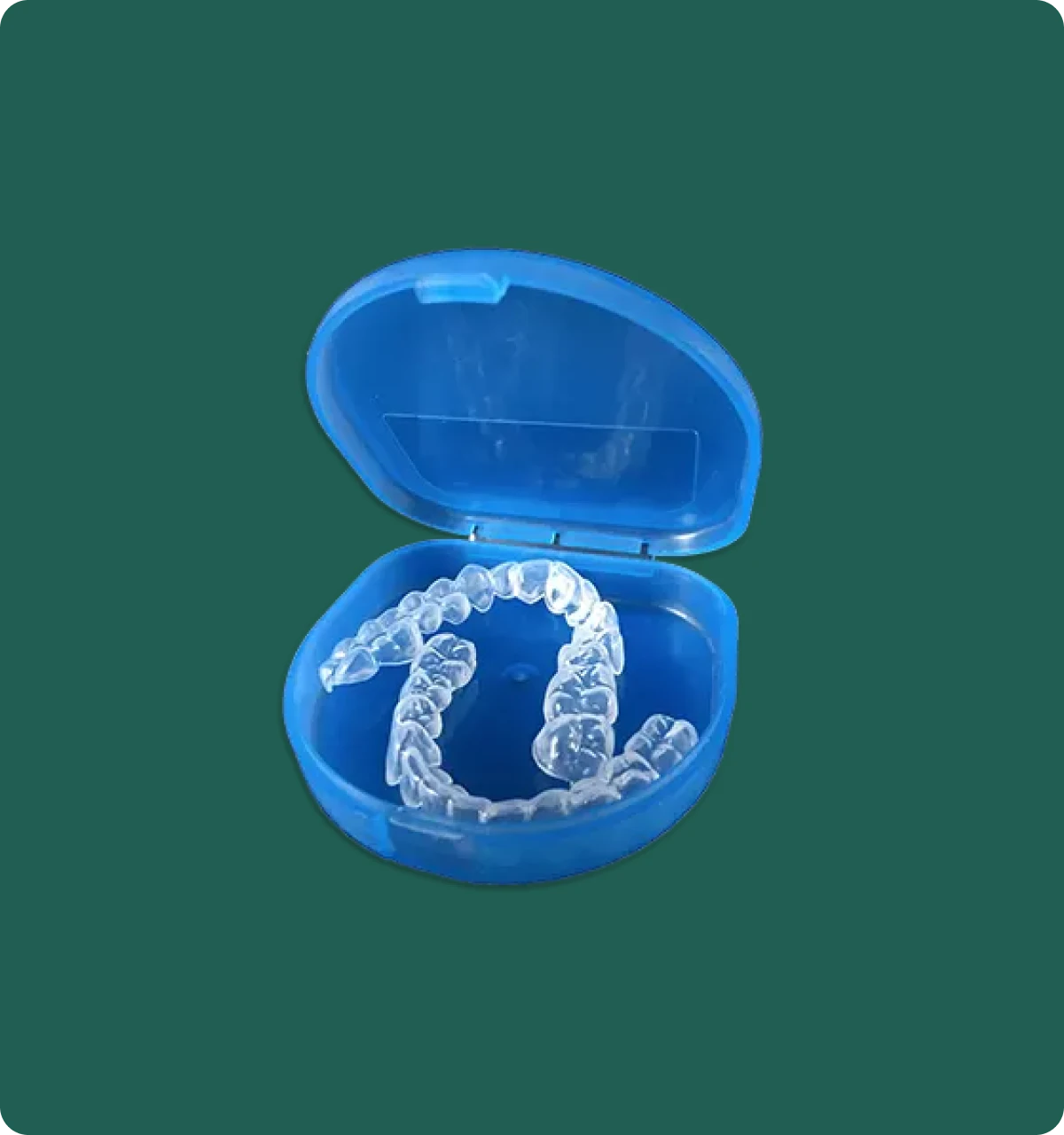 Close-up of a custom bleaching tray on a dental model, showing its thin, form-fitted design.