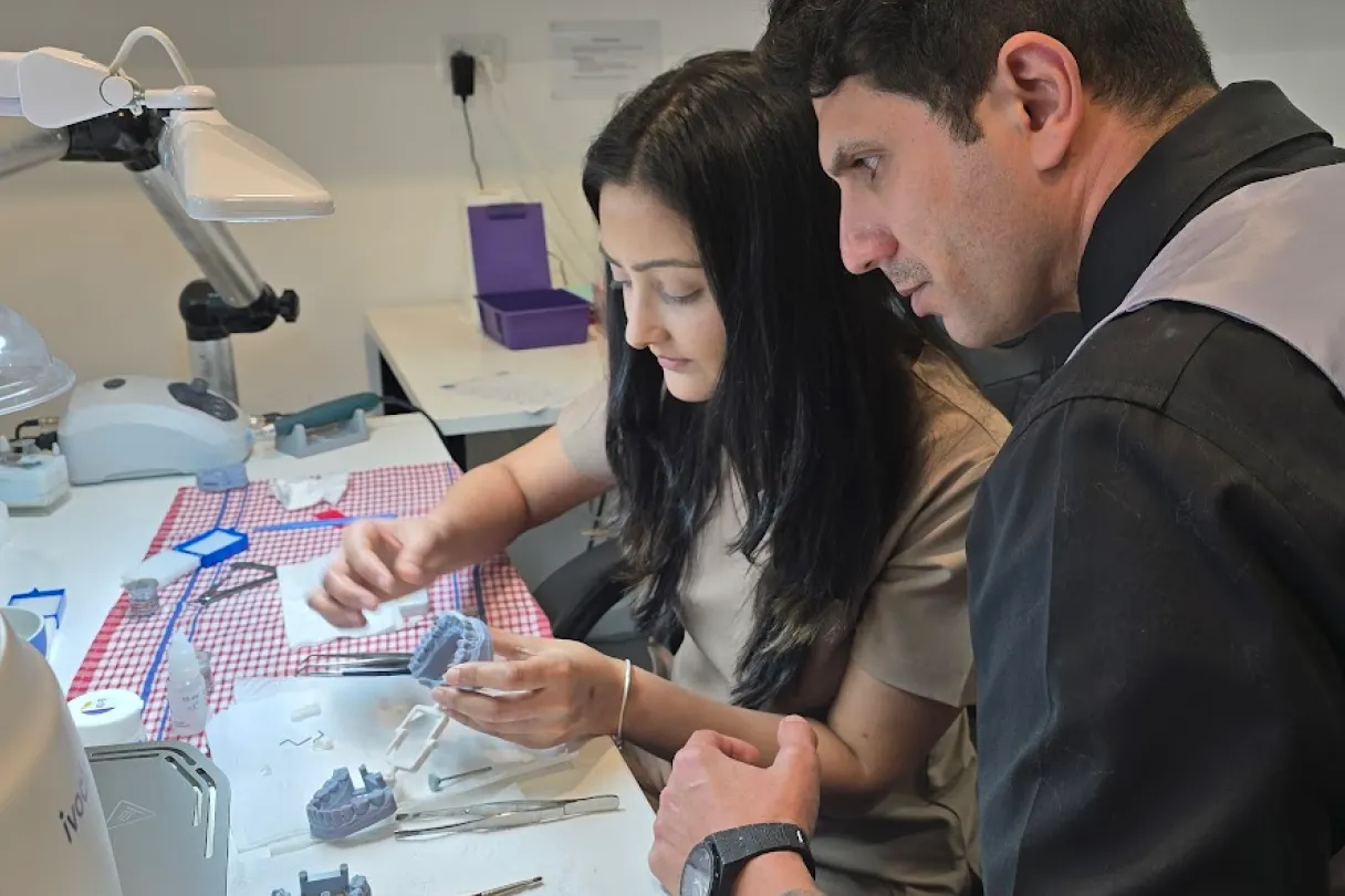 Dental lab technician working on a restoration as part of an outsourced lab workflow