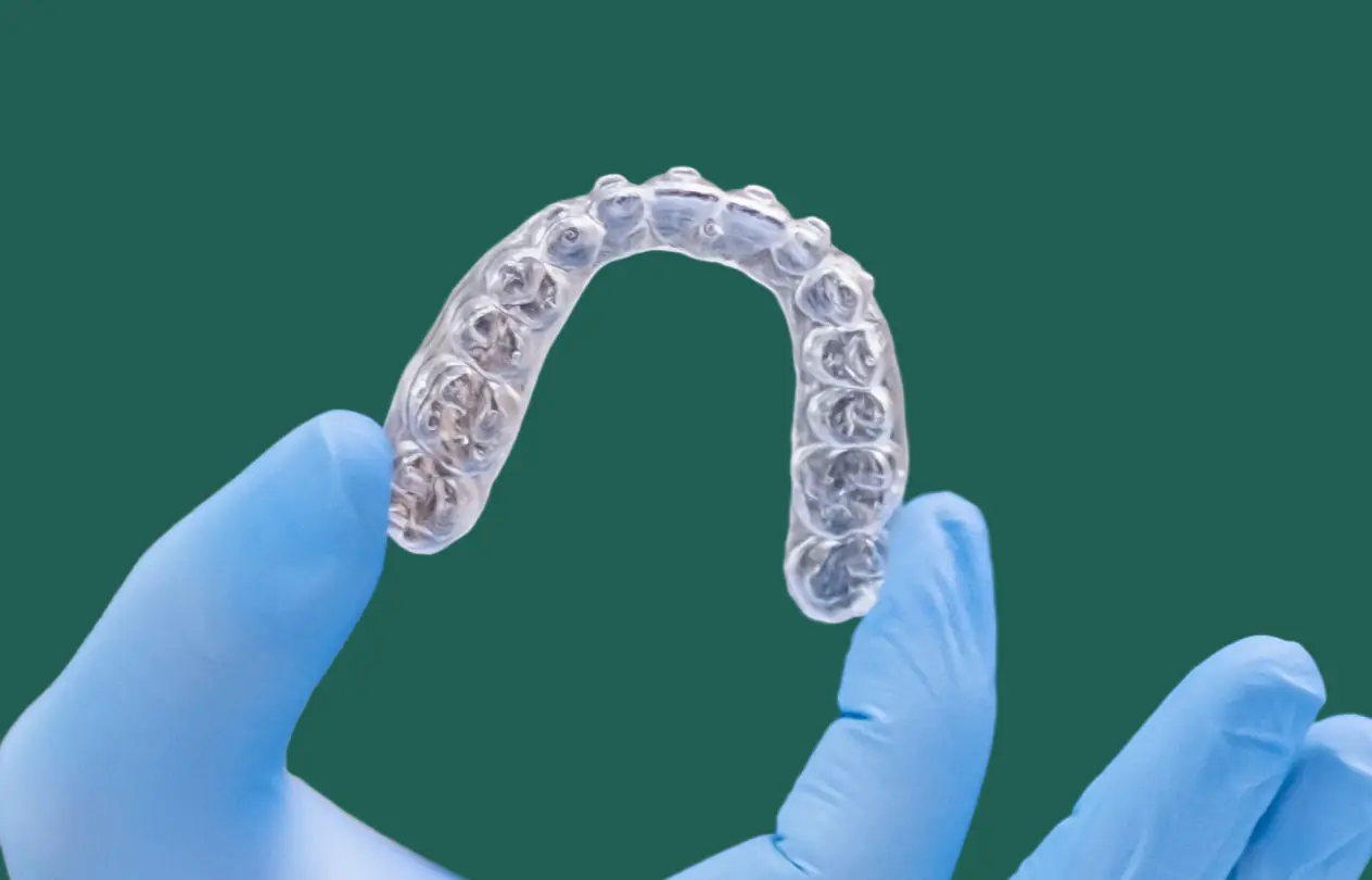 Clear occlusal splint appliance fitted over the upper teeth to protect against grinding