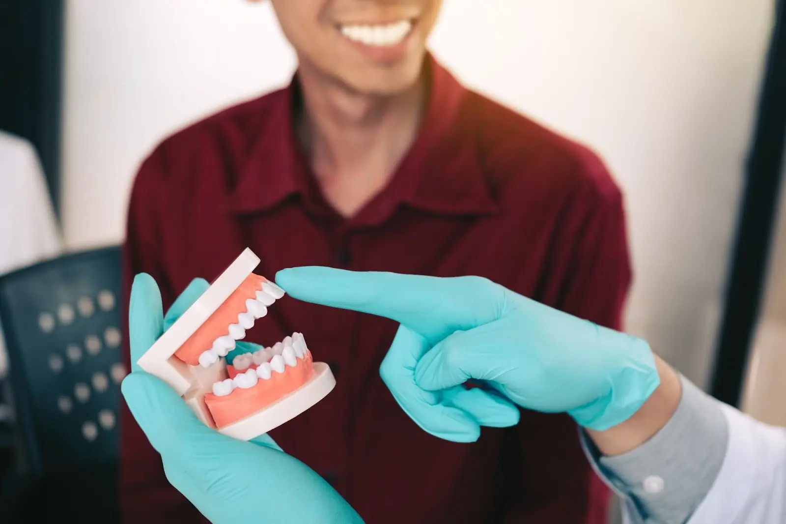 Digital smile design software overlay showing a planned tooth arrangement on a patient's facial photo