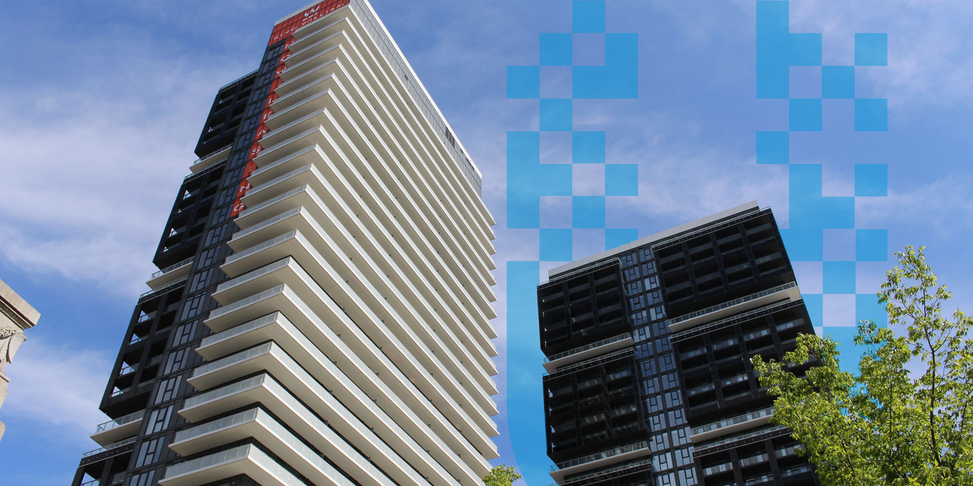 Modern high-rise residential building with glass balconies and reflective windows against a clear blue sky, representing urban development and city growth in Hamilton, Ontario.
